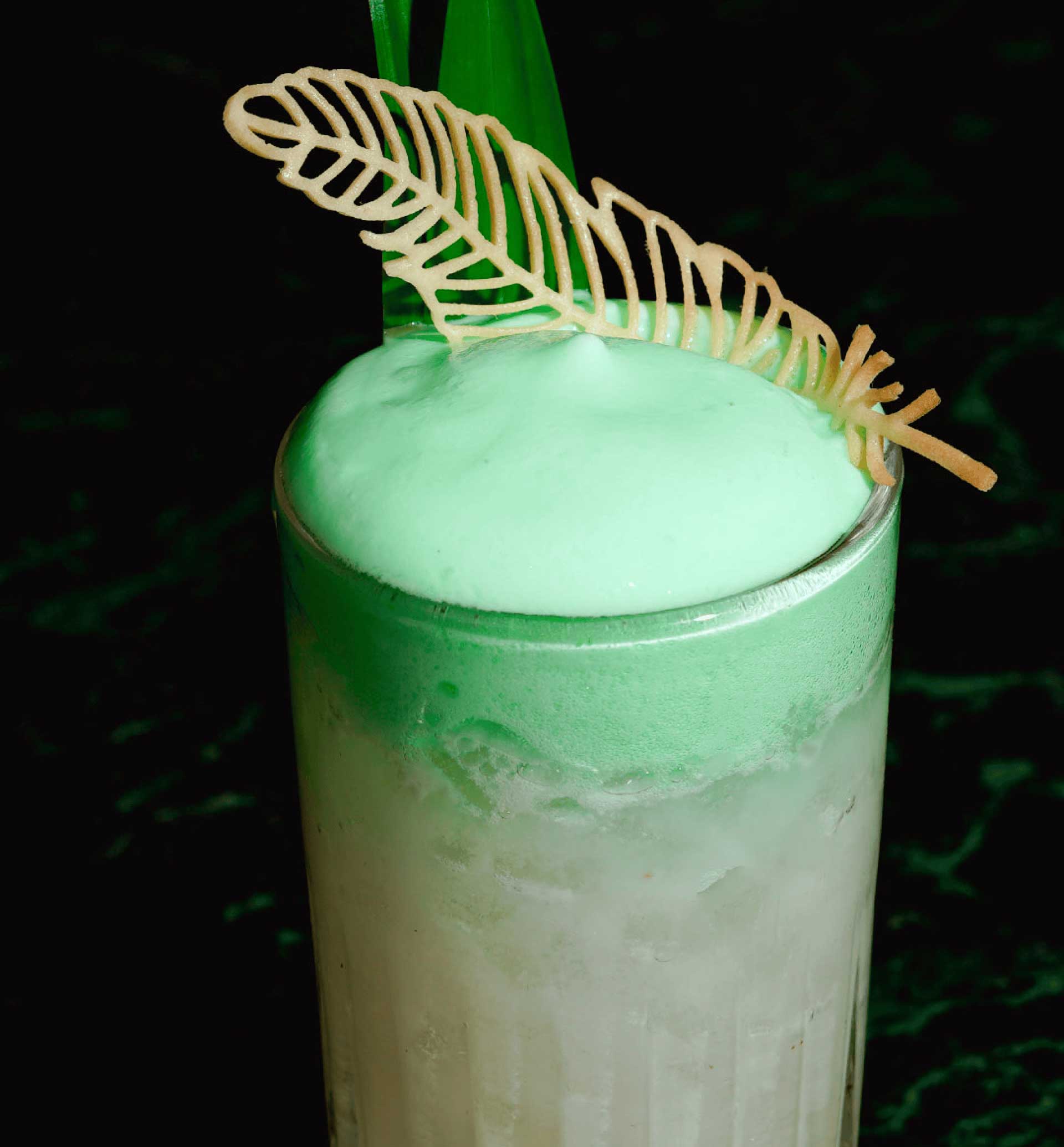 Green cocktail with mousse